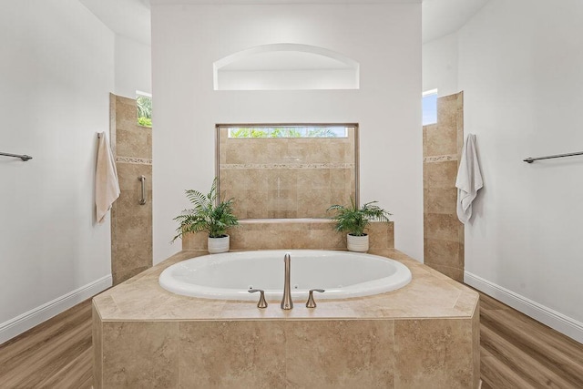 132 Steeple Cir, Jupiter, FL 33458 - full bathroom with a garden tub, wood finished floors, and baseboards