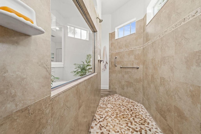 132 Steeple Cir, Jupiter, FL 33458 - bathroom with a tile shower and plenty of natural light