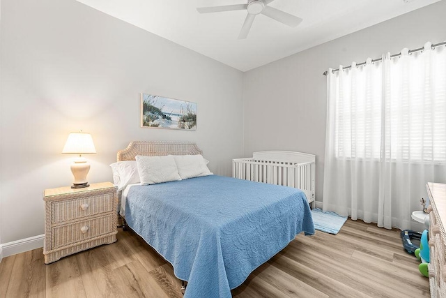 132 Steeple Cir, Jupiter, FL 33458 - bedroom with wood finished floors, baseboards, and a ceiling fan