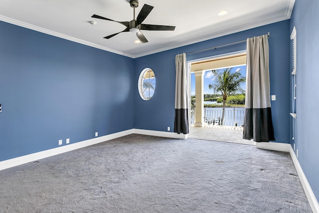 spare room with crown molding, carpet flooring, baseboards, ceiling fan, and recessed lighting