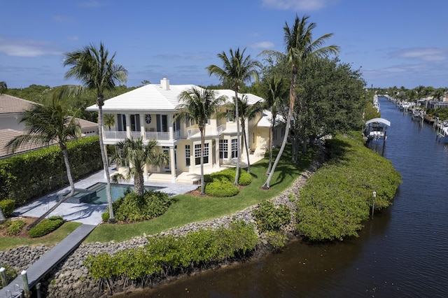 view of subject property with a nearby body of water