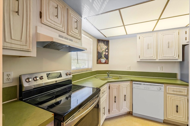 18081 SE Country Club Dr Unit 130, Jupiter, FL 33469 - kitchen with white dishwasher, electric range, a sink, under cabinet range hood, and light tile patterned flooring