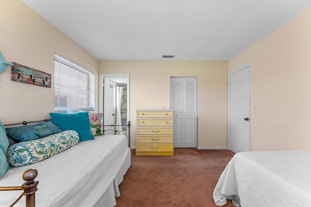 18081 SE Country Club Dr Unit 130, Jupiter, FL 33469 - bedroom featuring carpet flooring, a closet, and baseboards