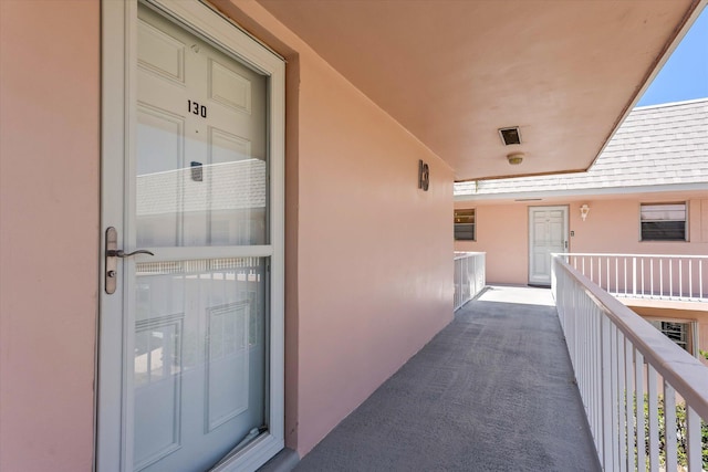 18081 SE Country Club Dr Unit 130, Jupiter, FL 33469 - entrance to property with a balcony and stucco siding