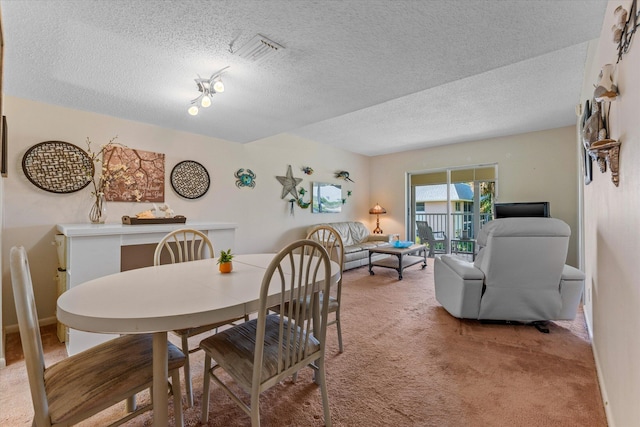 18081 SE Country Club Dr Unit 130, Jupiter, FL 33469 - dining space with light carpet and a textured ceiling