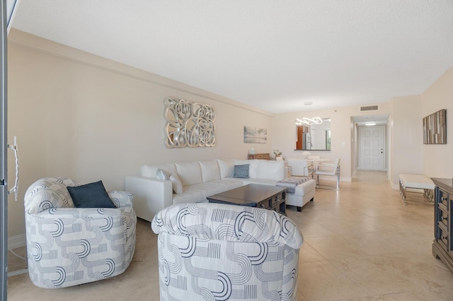 7240 Huntington Ln Unit 105, Delray Beach, FL 33446 - living area featuring a chandelier, visible vents, and light tile patterned flooring