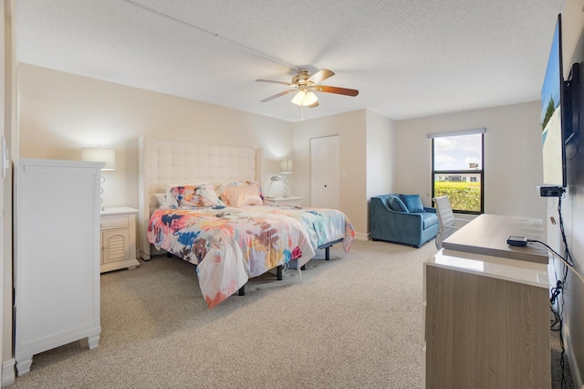 7240 Huntington Ln Unit 105, Delray Beach, FL 33446 - bedroom featuring baseboards, light carpet, ceiling fan, and a textured ceiling