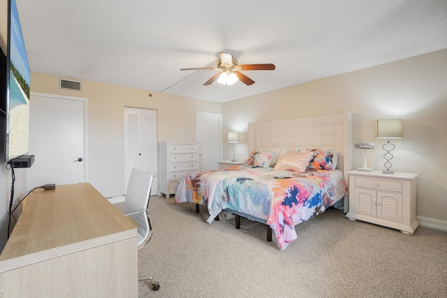 7240 Huntington Ln Unit 105, Delray Beach, FL 33446 - bedroom with a ceiling fan, a closet, baseboards, visible vents, and light colored carpet
