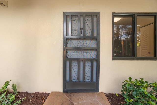 7240 Huntington Ln Unit 105, Delray Beach, FL 33446 - entrance to property with stucco siding