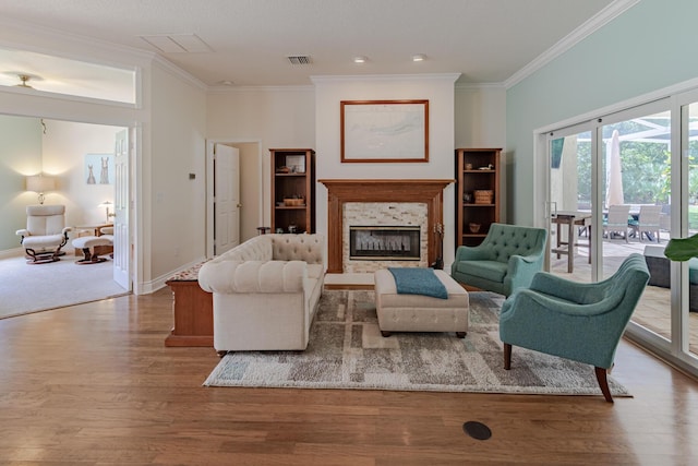 8005 SW Yachtsmans Dr, Stuart, FL 34997 - living area featuring crown molding, wood finished floors, a fireplace, and baseboards
