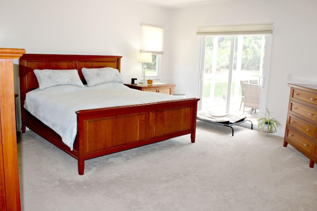 bedroom featuring carpet and access to outside