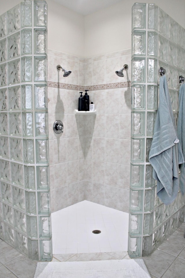full bathroom featuring a walk in shower and tile patterned floors