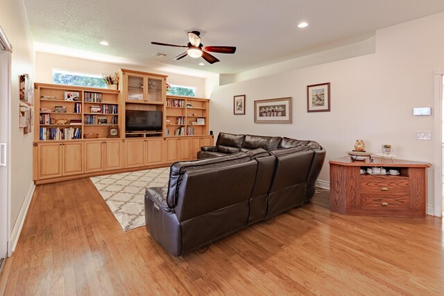 8005 SW Yachtsmans Dr, Stuart, FL 34997 - living room featuring ceiling fan, light wood finished floors, recessed lighting, and baseboards