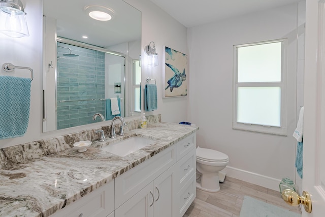 8005 SW Yachtsmans Dr, Stuart, FL 34997 - bathroom featuring a shower stall, vanity, toilet, baseboards, and wood finished floors