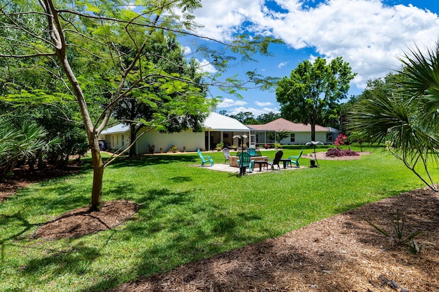 8005 SW Yachtsmans Dr, Stuart, FL 34997 - view of grassy yard with a patio