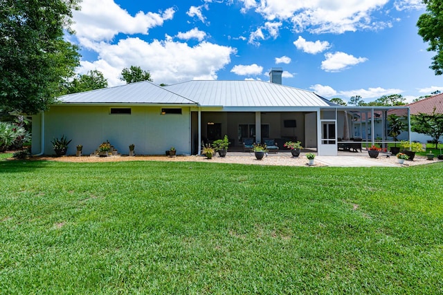 8005 SW Yachtsmans Dr, Stuart, FL 34997 - rear view of house with a patio, a lawn, a chimney, and metal roof