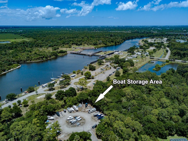 8005 SW Yachtsmans Dr, Stuart, FL 34997 - bird's eye view of a forest and a nearby body of water
