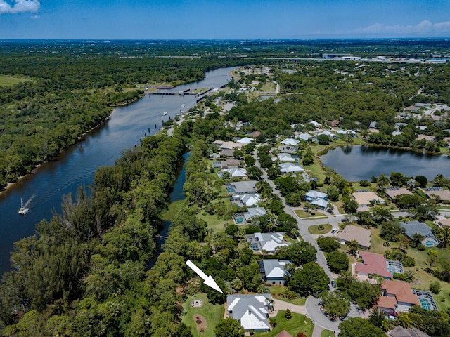 8005 SW Yachtsmans Dr, Stuart, FL 34997 - aerial perspective of suburban area featuring a large body of water