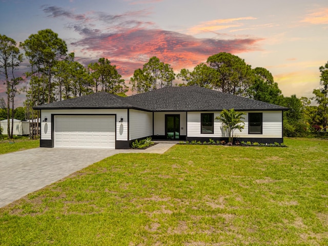 17816 86th St N, The Acreage, FL 33470 - view of front of property featuring a garage, a front lawn, and decorative driveway