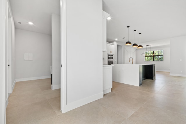 17816 86th St N, The Acreage, FL 33470 - kitchen featuring white cabinets, recessed lighting, an island with sink, and a sink