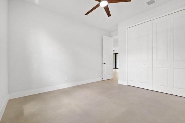 17816 86th St N, The Acreage, FL 33470 - unfurnished bedroom with ceiling fan, baseboards, finished concrete floors, visible vents, and a closet