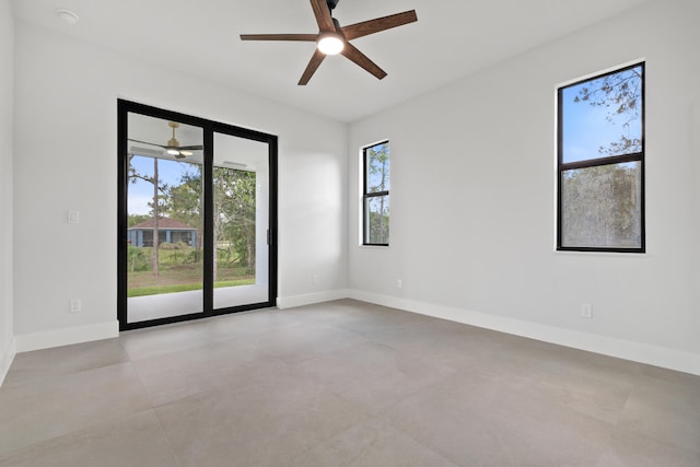 17816 86th St N, The Acreage, FL 33470 - unfurnished room with baseboards, a ceiling fan, and a wealth of natural light