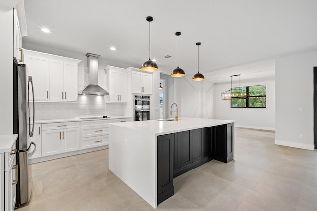 17816 86th St N, The Acreage, FL 33470 - kitchen featuring light countertops, wall chimney exhaust hood, tasteful backsplash, a sink, and stainless steel appliances