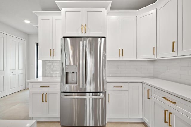 17816 86th St N, The Acreage, FL 33470 - kitchen featuring white cabinets, light countertops, recessed lighting, decorative backsplash, and stainless steel refrigerator with ice dispenser