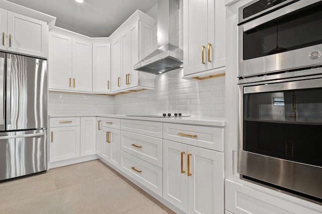 17816 86th St N, The Acreage, FL 33470 - kitchen with wall chimney range hood, backsplash, appliances with stainless steel finishes, light countertops, and white cabinets