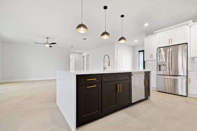 17816 86th St N, The Acreage, FL 33470 - kitchen featuring light countertops, a sink, stainless steel appliances, white cabinetry, and an island with sink