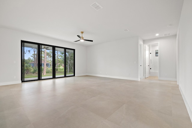 17816 86th St N, The Acreage, FL 33470 - spare room with light tile patterned floors, ceiling fan, visible vents, and baseboards