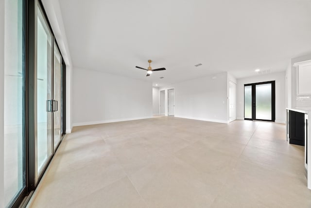 17816 86th St N, The Acreage, FL 33470 - unfurnished living room featuring ceiling fan and baseboards