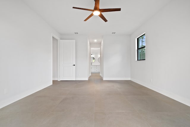 17816 86th St N, The Acreage, FL 33470 - spare room with light tile patterned floors, baseboards, ceiling fan, and visible vents