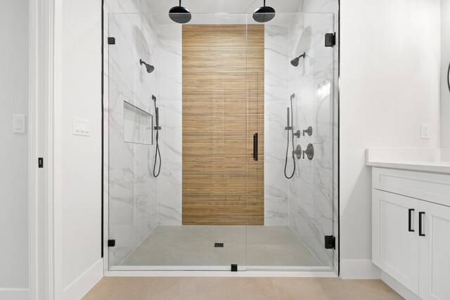 17816 86th St N, The Acreage, FL 33470 - full bathroom featuring vanity, a marble finish shower, and baseboards