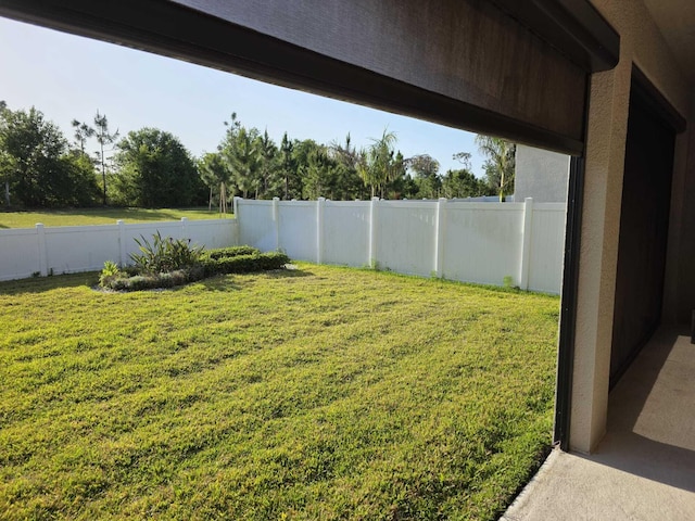 view of yard featuring a fenced backyard