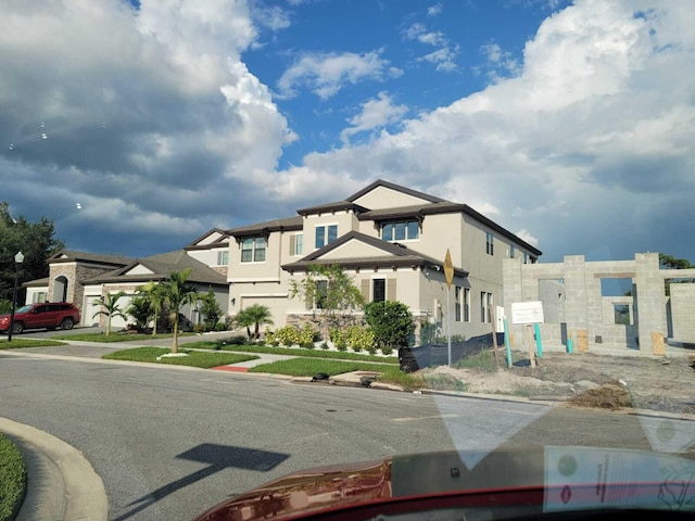 exterior space featuring a residential view and stucco siding