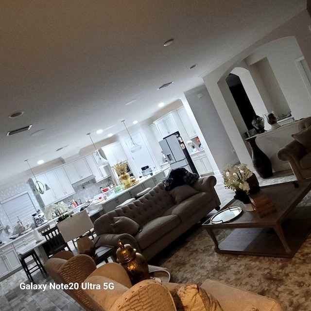 living room featuring recessed lighting