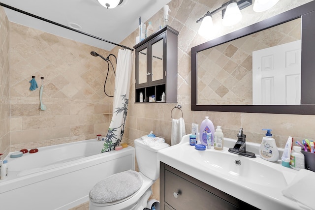 bathroom featuring vanity, shower / bath combo, toilet, and tile walls