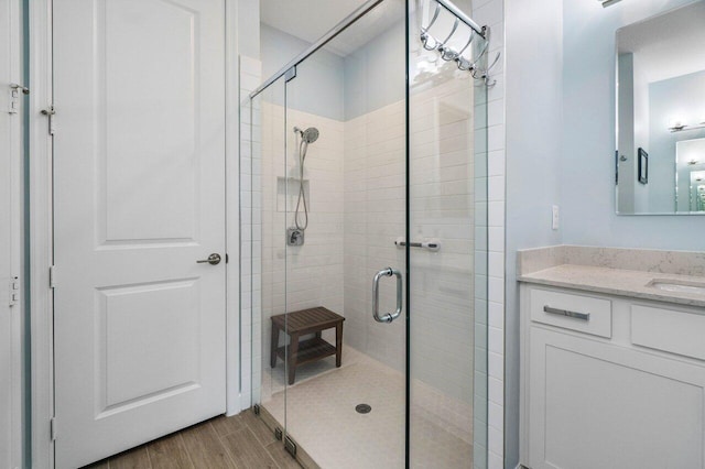 1220 Haywagon Trl, The Acreage, FL 33470 - full bathroom with a stall shower, vanity, and wood finished floors