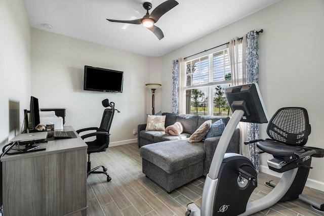 1220 Haywagon Trl, The Acreage, FL 33470 - home office featuring a ceiling fan, baseboards, and wood finished floors