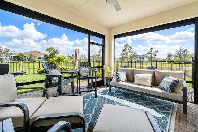 1220 Haywagon Trl, The Acreage, FL 33470 - sunroom / solarium featuring ceiling fan, brick floor, and an outdoor living space