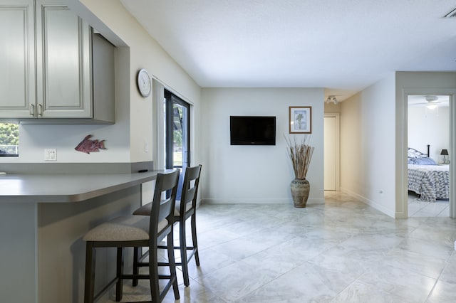 185 Bilbao St, Royal Palm Beach, FL 33411 - dining space featuring baseboards, plenty of natural light, marble finish floor, and visible vents