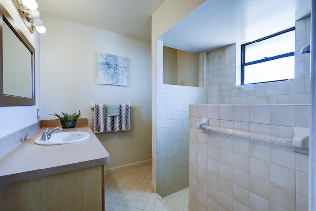 185 Bilbao St, Royal Palm Beach, FL 33411 - full bathroom with vanity, tile patterned flooring, baseboards, and walk in shower