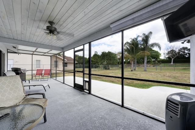 185 Bilbao St, Royal Palm Beach, FL 33411 - sunroom featuring a ceiling fan and outdoor dining space