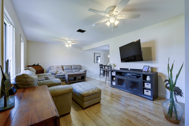 185 Bilbao St, Royal Palm Beach, FL 33411 - living room featuring visible vents, light wood-style flooring, ceiling fan, and baseboards