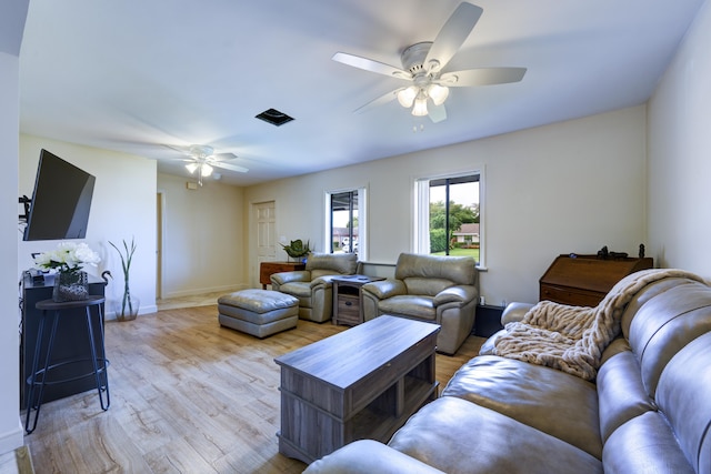 185 Bilbao St, Royal Palm Beach, FL 33411 - living area featuring baseboards, a ceiling fan, and light wood-style flooring