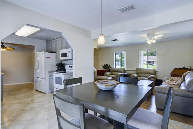 185 Bilbao St, Royal Palm Beach, FL 33411 - dining room featuring visible vents and a ceiling fan