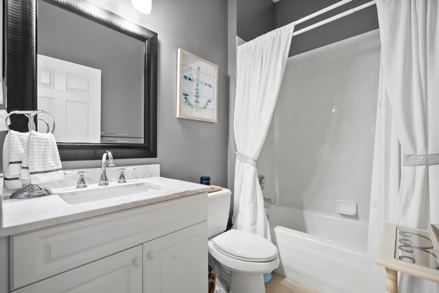 clothes washing area with cabinet space, washing machine and clothes dryer, and baseboards