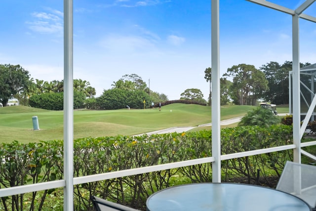 sunroom / solarium with view of golf course