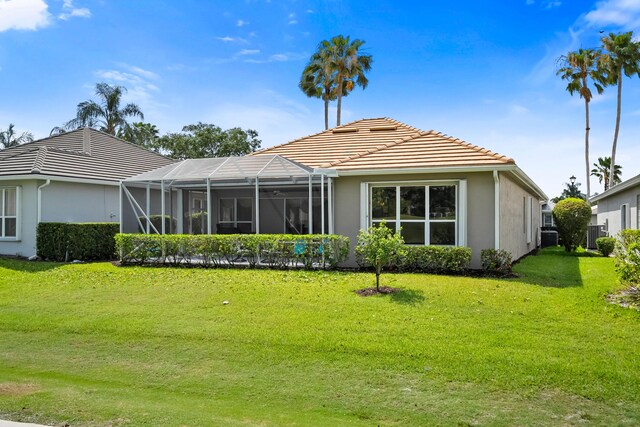 view of property hidden behind natural elements with an attached garage, stucco siding, driveway, and a front lawn
